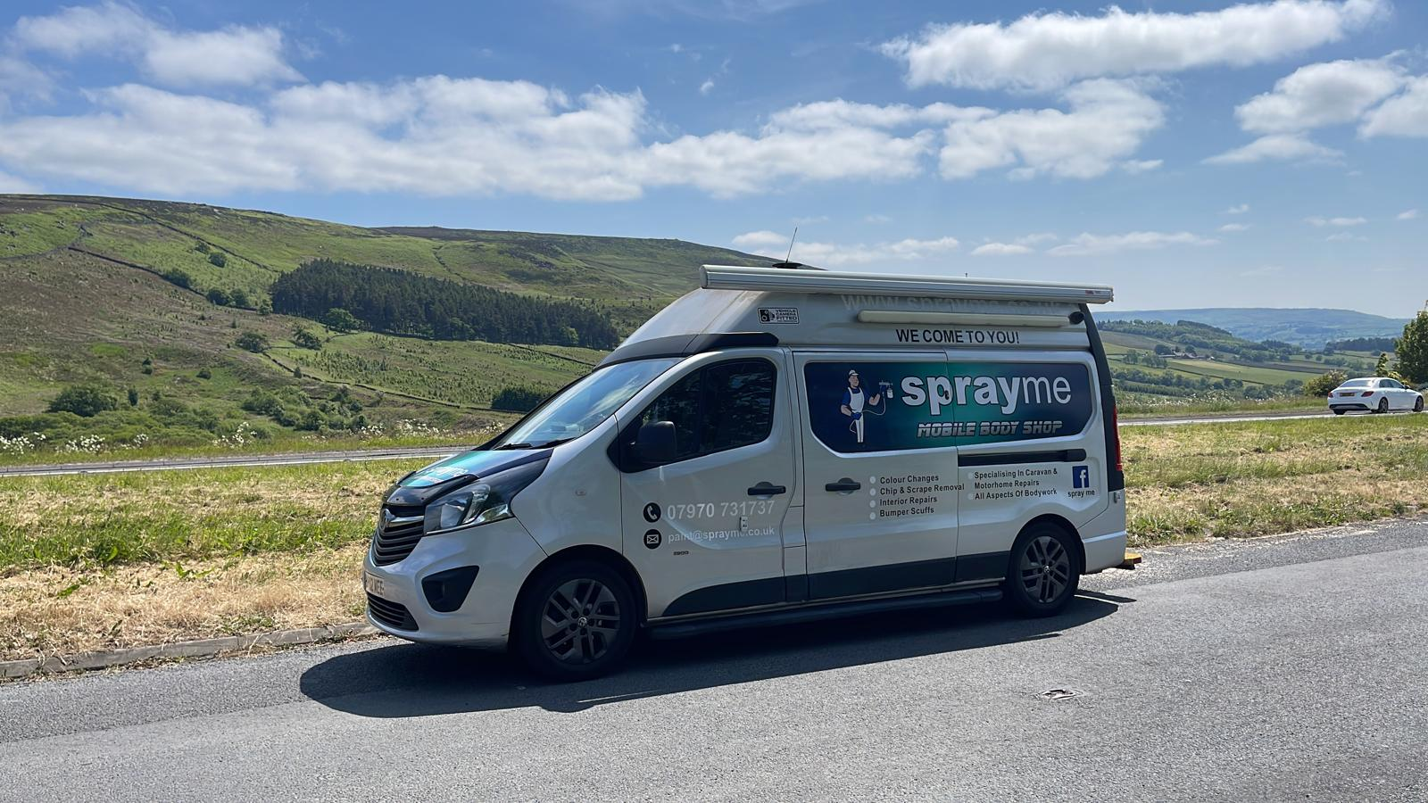 Spray Me mobile body shop van on the road